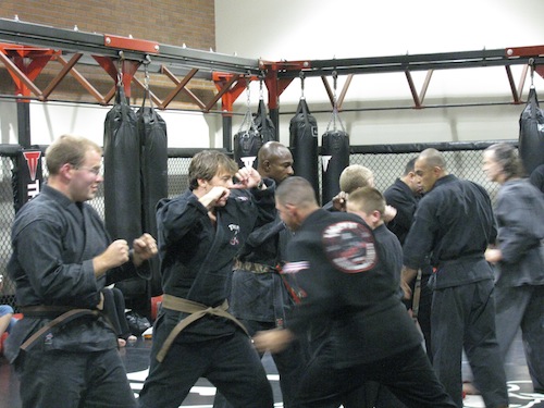 Adults training MMA at the Pit